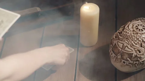 Scene of fortune-teller placing tarot cards on table. Mystic ritual of Stock Footage 137194395