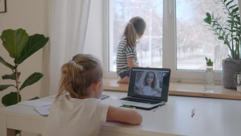 Scene from home life, a boy in a lockdown communicates via video link with a cla Stock Footage 128077968