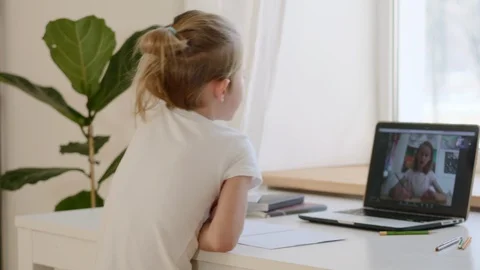 Scene from home life, a boy in a lockdown communicates via video link with a gir Stock Footage 128080183