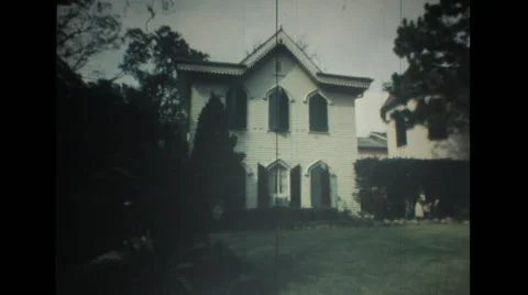 Scene of hotel which is a converted house, tourists see an historic house Stock Footage 37595360
