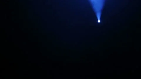 Scene illumination with a profiled blue beam of a profile spotlight in the smoke Stock Footage 97136403
