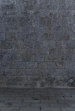 Scene of Irregular dark gray bricks dirty and wet wall background Stock Photos