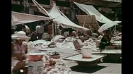 Scene Of Local City Market, Populated Streets With Vehicle And People - 1974 Stock Footage