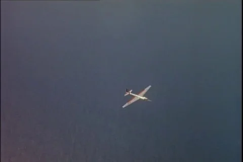 Scene of Lockheed U-2 aircraft No. 66715 in flight over water and clouds - 1960 Stock Footage 101167245