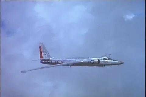 Scene of Lockheed U-2 No. 66715 aircraft in flight to right above clouds - 1960 Stock Footage 101167160