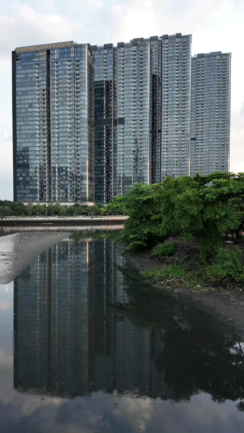 Scene of luxury apartment reflect on riverbed when low tide, high rise buil.. Stock Footage 284899531