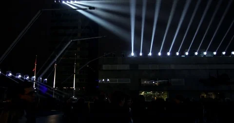 Scene with moving light bundles hovering over people Stock Footage 82390738