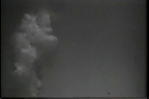 Scene of mushroom cloud formation after explosion during atom bomb test - 1946 Stock Footage 92805393