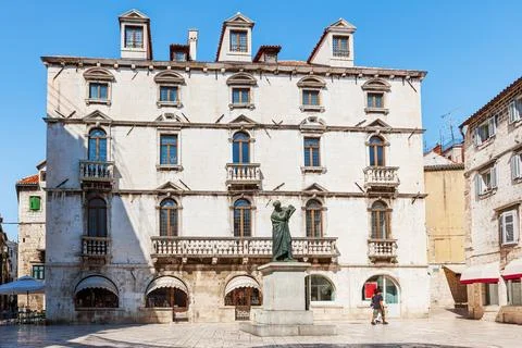 A scene from the old town of Split and a view of the monument to Marko Maru.. Stock Photos