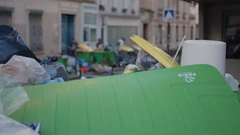 Scene of a Paris road full of garbage. Focus on the foreground Video stock 247491476