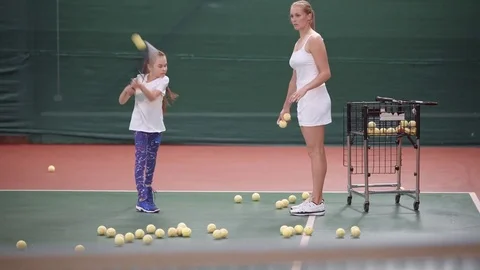 Scene of practicing of tennis game. Young girl practicing Stock Footage 77195347