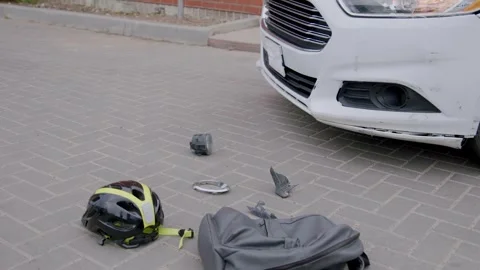 The scene of a road accident between a car and an electric scooter. Footage of a Stock Footage 248175254