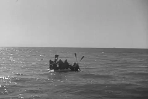 Scene of ship arriving to rescue a sailor - 1943 Stock Footage 101417351