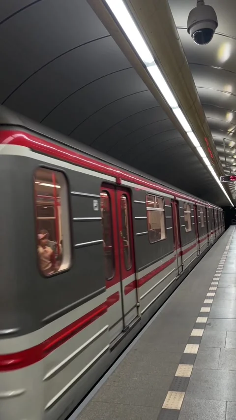 Scene showing commuters waiting as train approaches with security measures Stock Footage 335367050