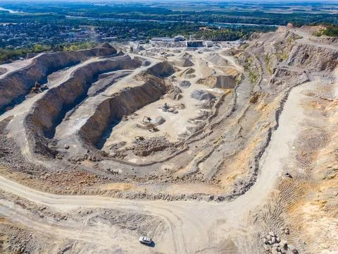 The scene shows a big quarry with different levels and shapes of the land. Tr Stock Photos