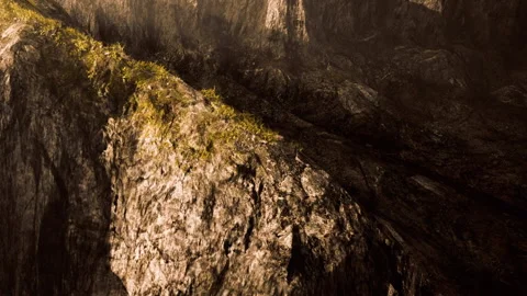 The scene shows a rugged rocky surface with patches of grass Stock Footage 339862135