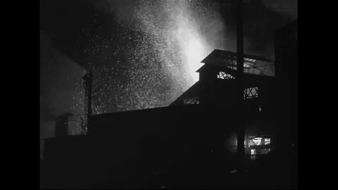 Scene of sparks come out of foundry in steel factory at night - 1939 Stock Footage 101732139