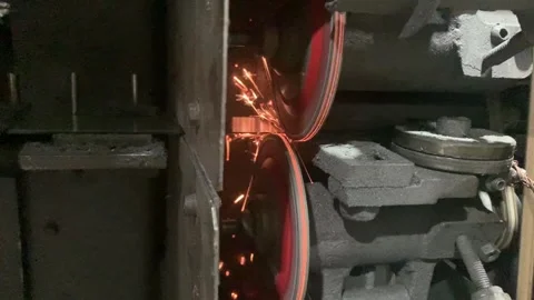 The scene of sparks during the process of sharpening the blade Stock Footage 315432081