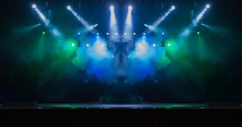 Scene, stage light with colored spotlights and smoke Photos