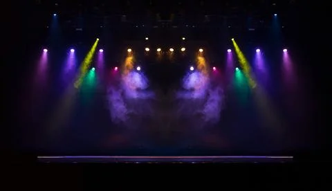 Scene, stage light with colored spotlights and smoke Stock Photos