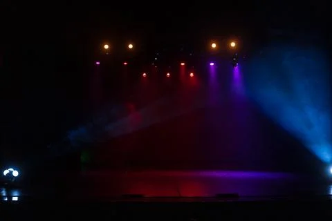 Scene, stage light with colored spotlights and smoke 库存照片