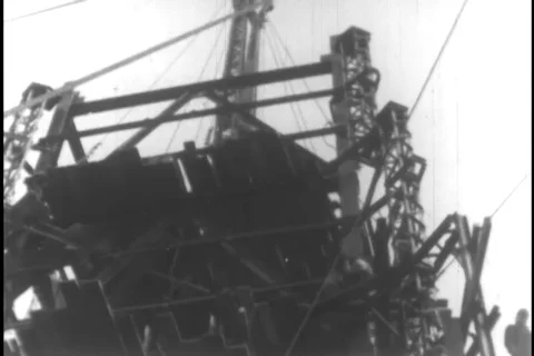 Scene of structural beam carried to build the tower - 1930 Stock Footage 104336526