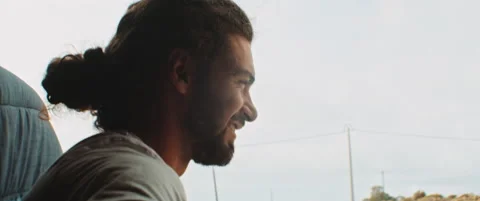 Scene of two men enjoying van life while playing the guitar Stock Footage 203584216