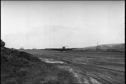 Scene of two P-40's on landing roll singly on sandy runway - 1942-1943 Stock Footage 104653537