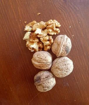 Scene of walnuts in their shells and without them Stock Photos