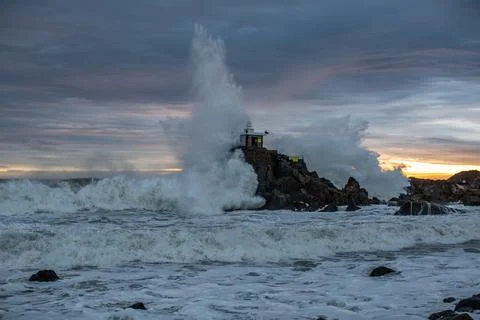 A scene in which powerful waves strike the hermitage Stock Photos
