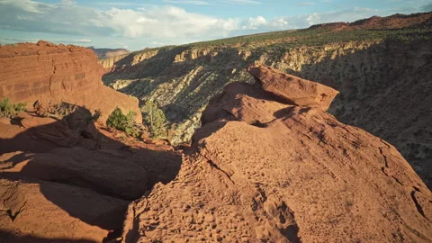Scenery behind the rocks becomes visible at Goosenecks point at Capitol Reef Stock Footage 209148617