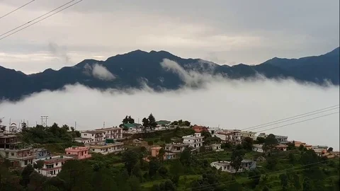 Scenery of Floating clouds between city and mountains Stock Footage 103657048