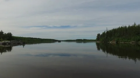 Scenery of a lake surrounded by forest Stock Footage 87509828