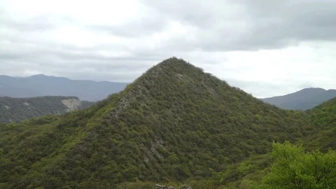 Scenery with mountain peaks and cloudy sky Stock Footage 77388542