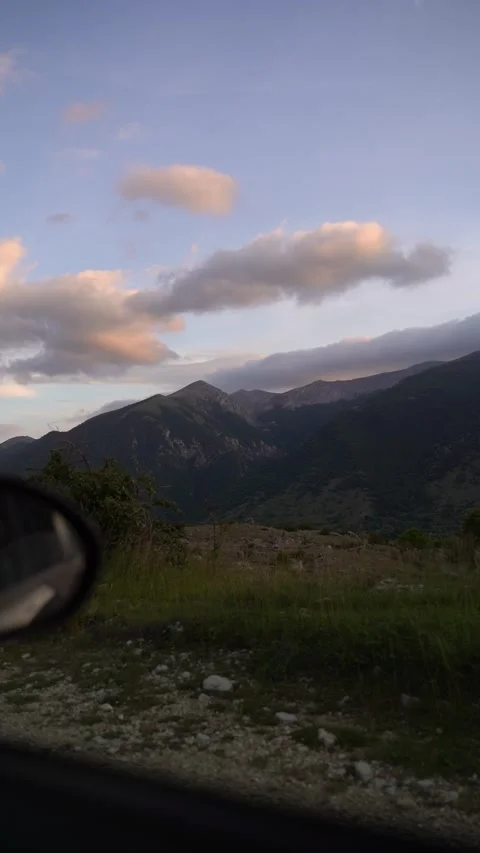 The scenery of the mountains outside the car window 動画素材 168243483