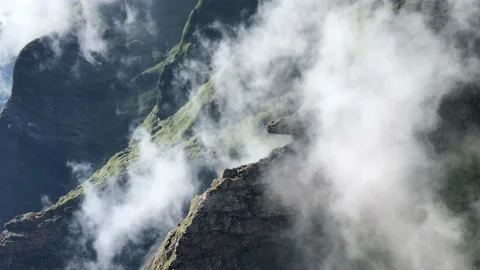 Scenery mountains partly hidden in clouds Видео 151885217