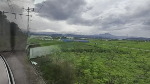Scenery Outside the Window as the Train Turns Stock Footage 323912355