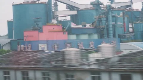 The scenery outside the window of a train while sitting on a high-speed rail in  Stock Footage 157532103