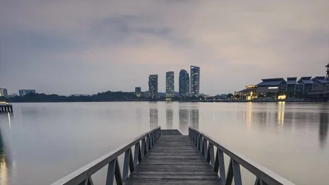 Scenery of sun rising at Pullman jetty, Putrajaya. Pan Down Timelapse Motion Stock Footage 83016122