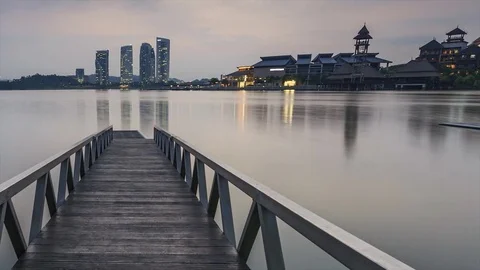 Scenery of sun rising at Pullman jetty, Putrajaya. Pan Left Timelapse Motion Video stock 83016124