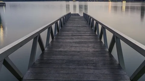 Scenery of sun rising at Pullman jetty, Putrajaya. Pan Up Timelapse Motion Video stock 83016770