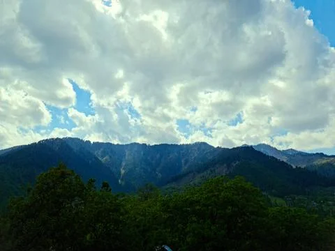 Scenery on a sunny day with clouds on the sky Stock Photos