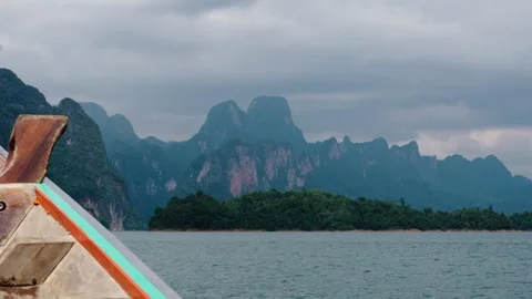 Scenery Of Towering Limestone Cliffs At Cheow Larn Lake In Khao Sok National Stock Footage 303976459