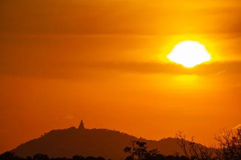 Scenery view of the sun down behind the mountain ridge Stock Photos