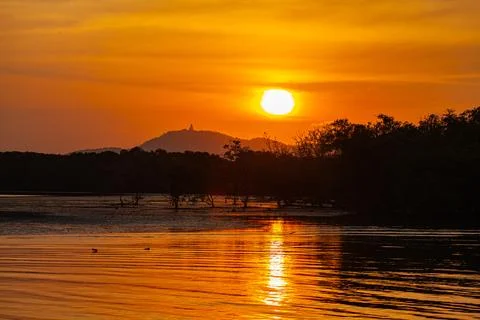 Scenery view of the sun down behind the mountain ridge Stock Photos