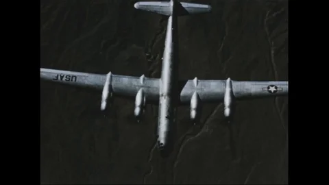Scenes of Boeing B-50 Superfortress fly mid-air during atomic bomb test - 1953 Stock Footage
