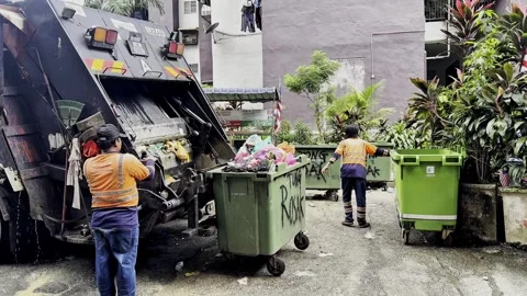 A scenes from a collection workers collected a wastes material at the apartment Stock Footage 321957602