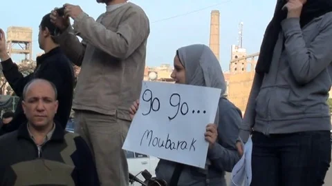 Scenes of demonstrators flocking into Cairo streets Stock Footage 114839085