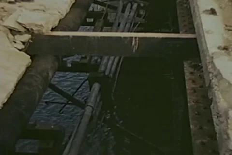 Scenes of destructive bridge passes over river - 1946 Stock Footage 103372374