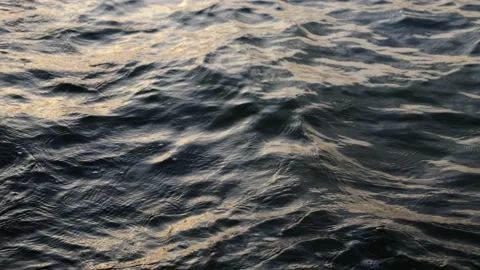 Scenes with dim light, surging waves on the surface of the sea, smooth surfaces Video stock 130903659